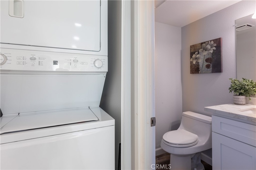 12635 Briarglen Loop, Unit H Stanton, CA 90680 - Photo 17 of 43 a close view of a sink and a toilet in a bathroom