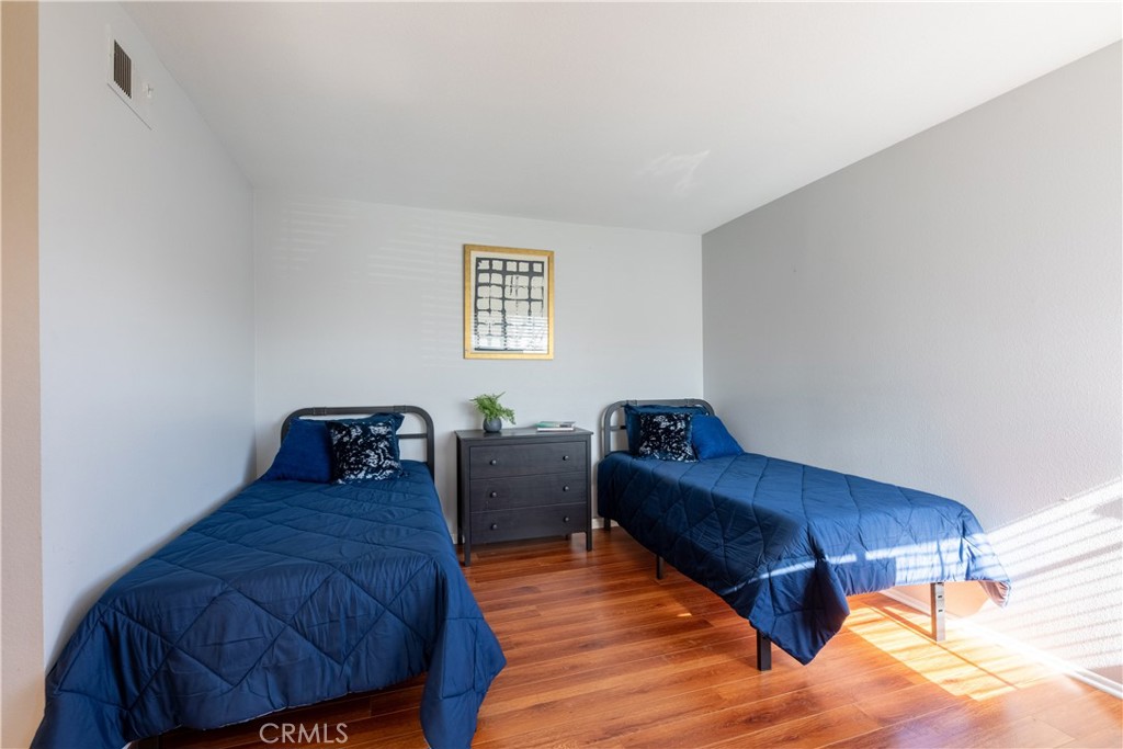 12635 Briarglen Loop, Unit H Stanton, CA 90680 - Photo 22 of 43 a living room with furniture and a window
