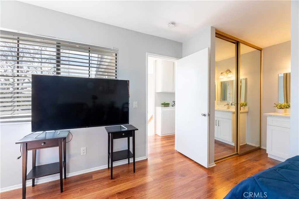 12635 Briarglen Loop, Unit H Stanton, CA 90680 - Photo 24 of 43 a view of a livingroom with furniture and wooden floor