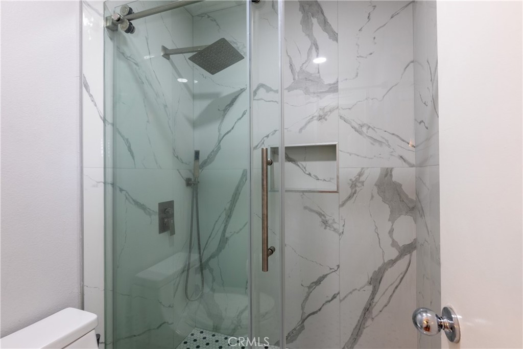 12635 Briarglen Loop, Unit H Stanton, CA 90680 - Photo 27 of 43 a bathroom with a shower