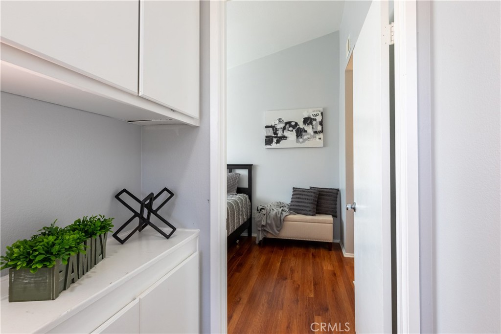 12635 Briarglen Loop, Unit H Stanton, CA 90680 - Photo 28 of 43 a living room with furniture and a potted plant