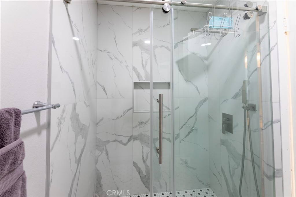 12635 Briarglen Loop, Unit H Stanton, CA 90680 - Photo 35 of 43 a bathroom with a shower