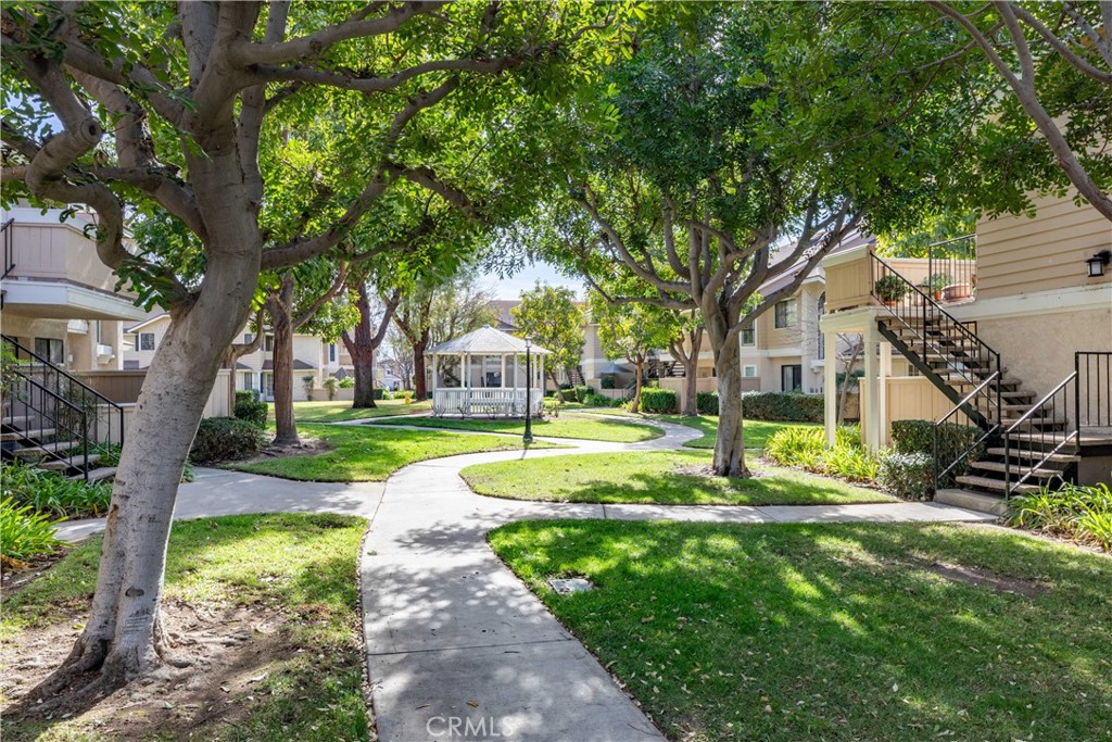 12635 Briarglen Loop, Unit H Stanton, CA 90680 - Photo 41 of 43 a view of a house with garden and trees