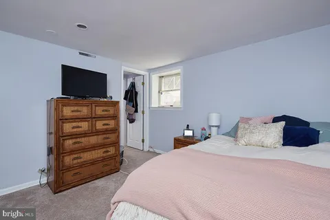 a bedroom with a bed and furniture