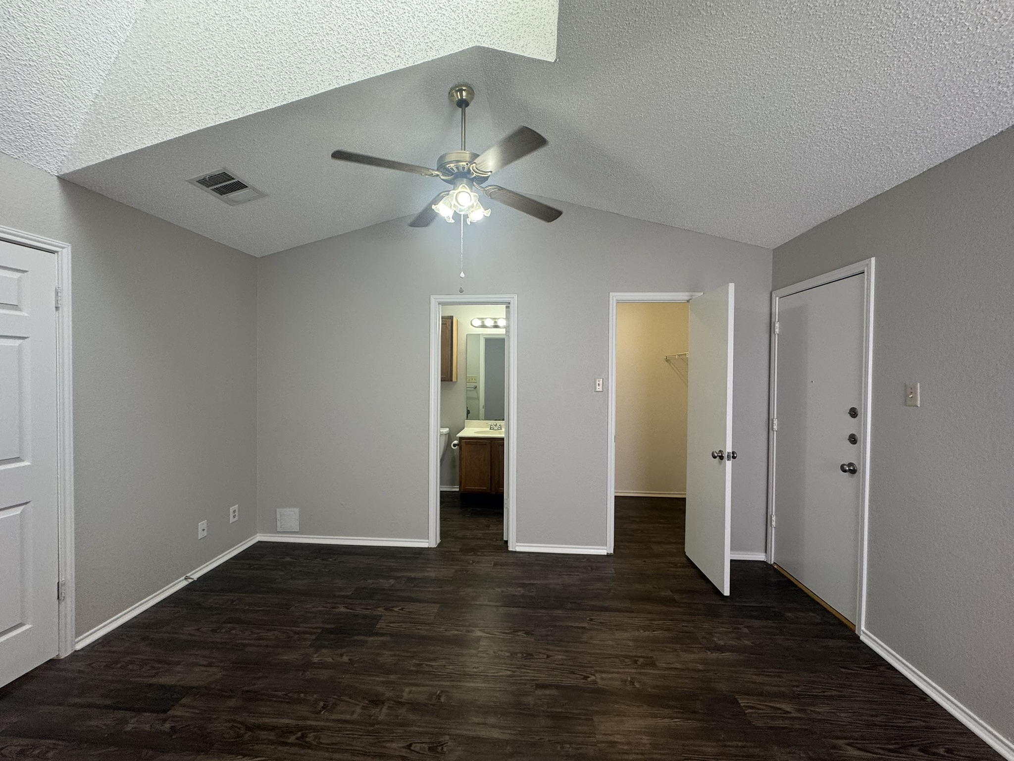 522 Cutty Trail, Unit B Lakeway, TX 78734 - Photo 14 of 20 Lofty vaulted ceilings and rich dark flooring define this inviting living space.