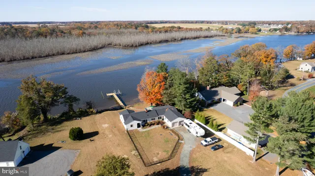an aerial view of a house with garden space and outdoor seating