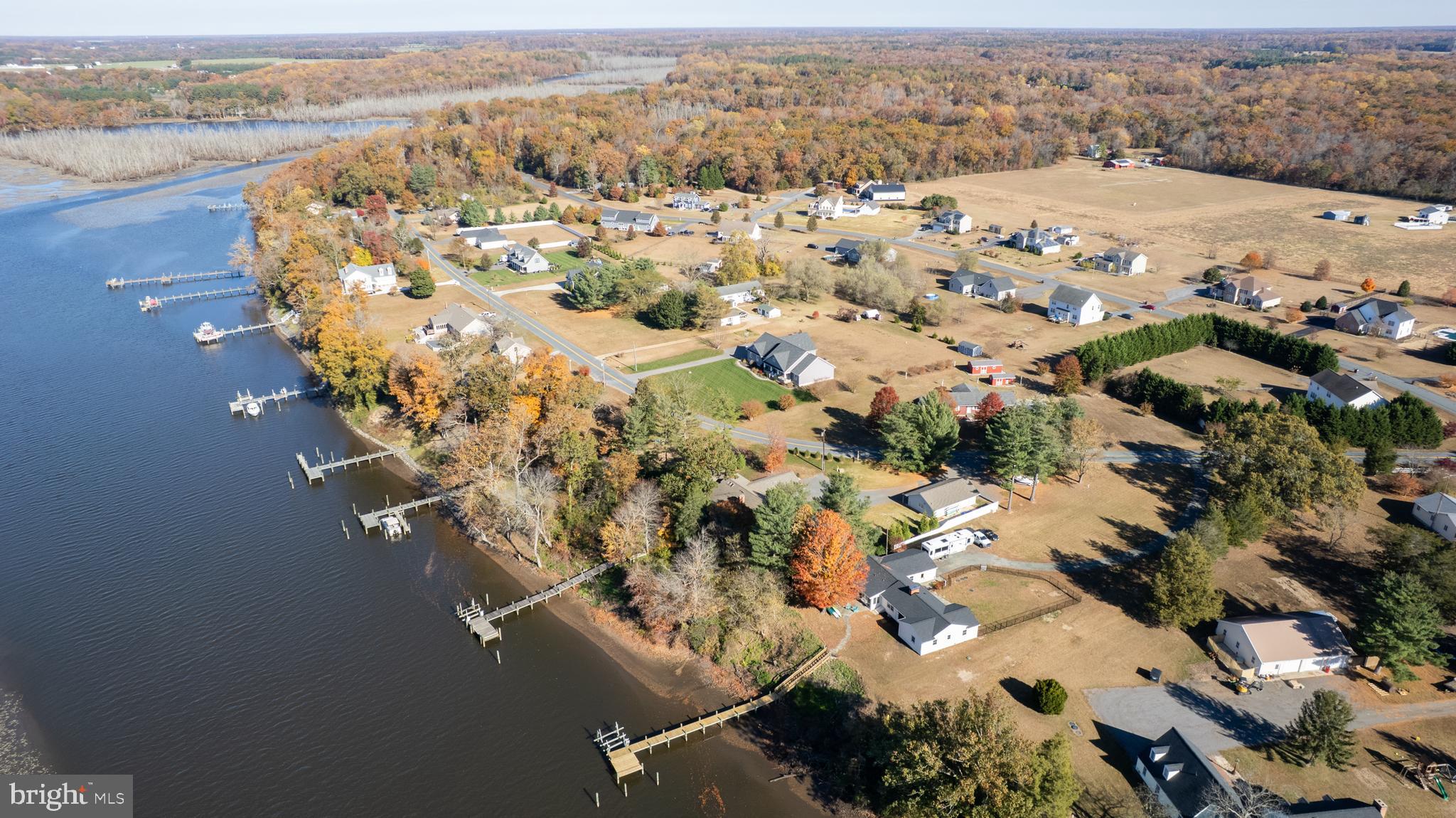 25211 Adams Landing Road Denton, MD 21629 - Photo 18 of 58 an aerial view of a house with a lake view