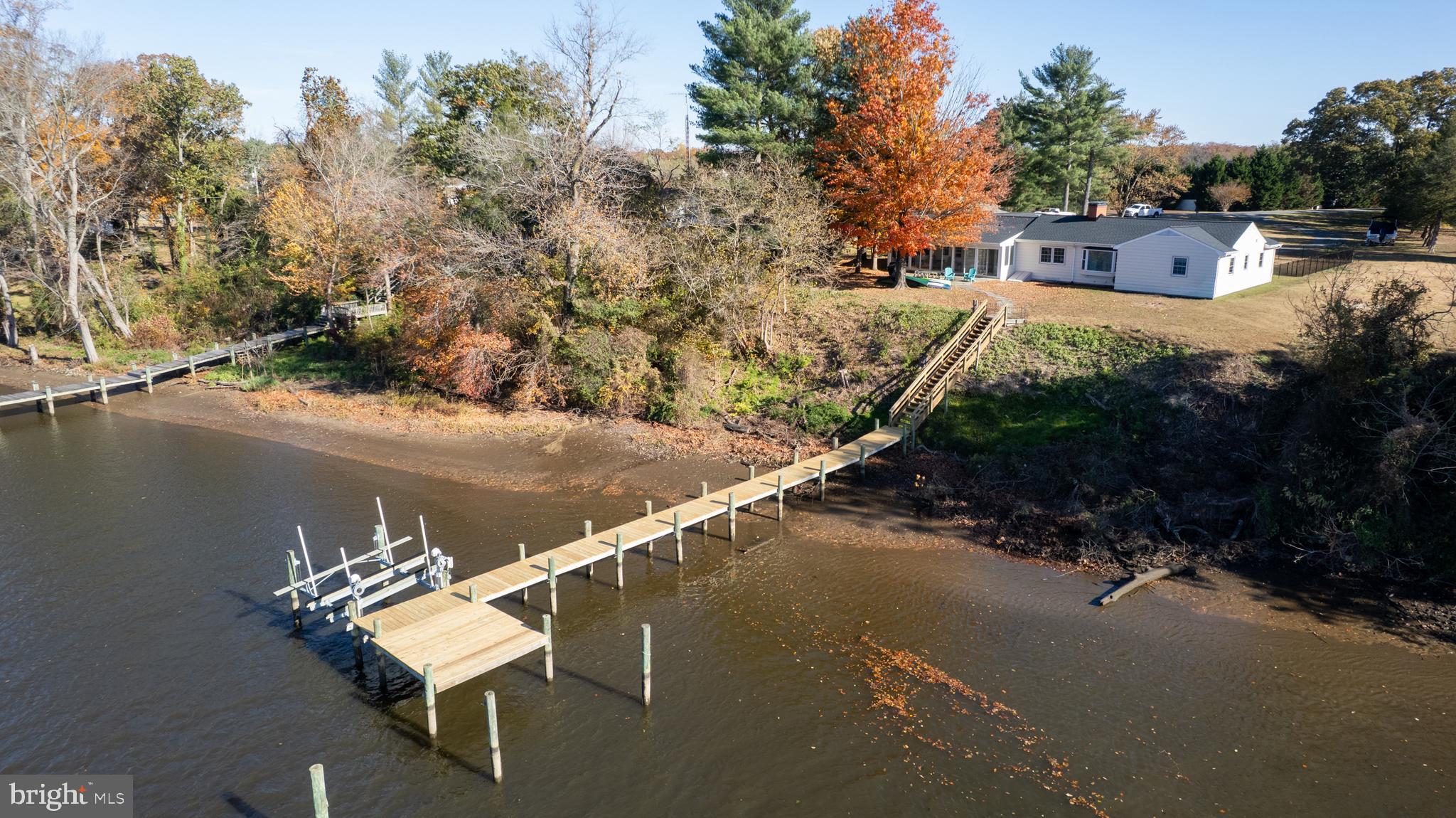 25211 Adams Landing Road Denton, MD 21629 - Photo 19 of 58 a view of a patio in back of a house