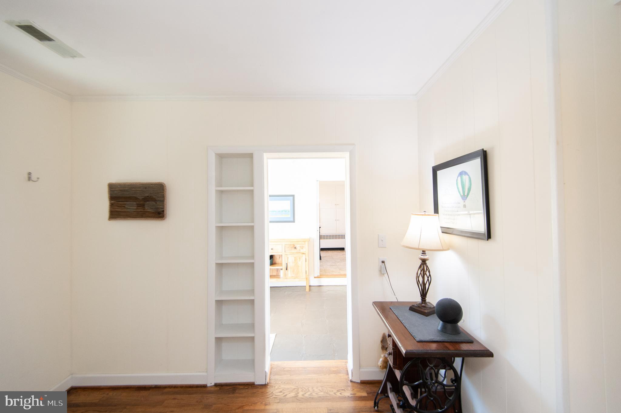 25211 Adams Landing Road Denton, MD 21629 - Photo 24 of 58 a view of workspace with wooden floor lounge chair and windows
