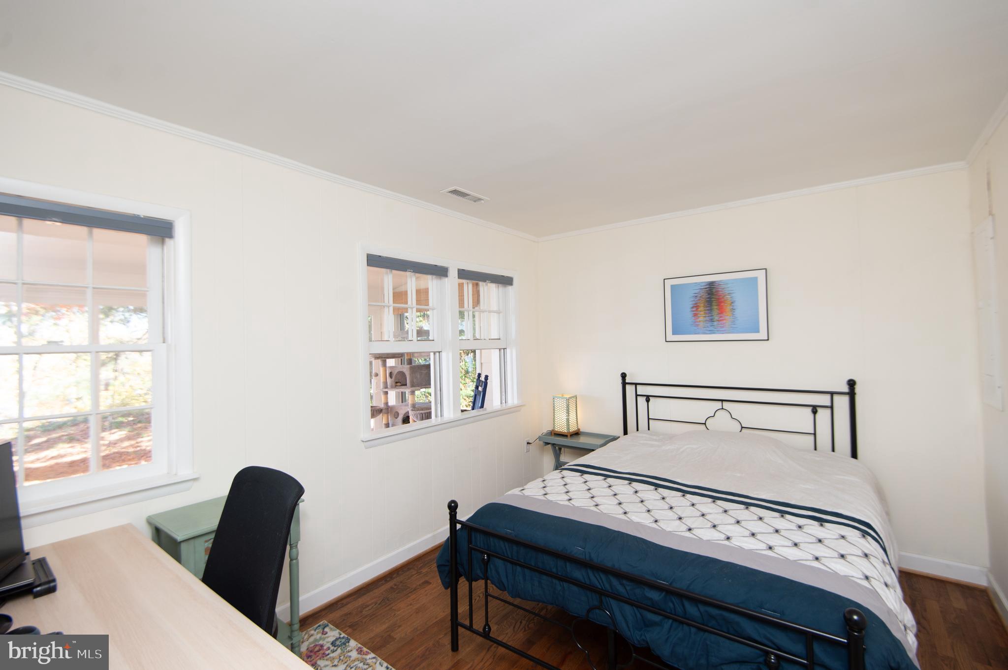 25211 Adams Landing Road Denton, MD 21629 - Photo 28 of 58 a bedroom with a bed and a window