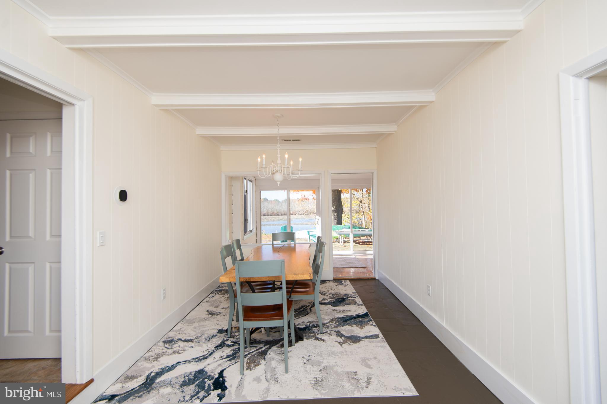 25211 Adams Landing Road Denton, MD 21629 - Photo 31 of 58 a dining room with a table and chairs