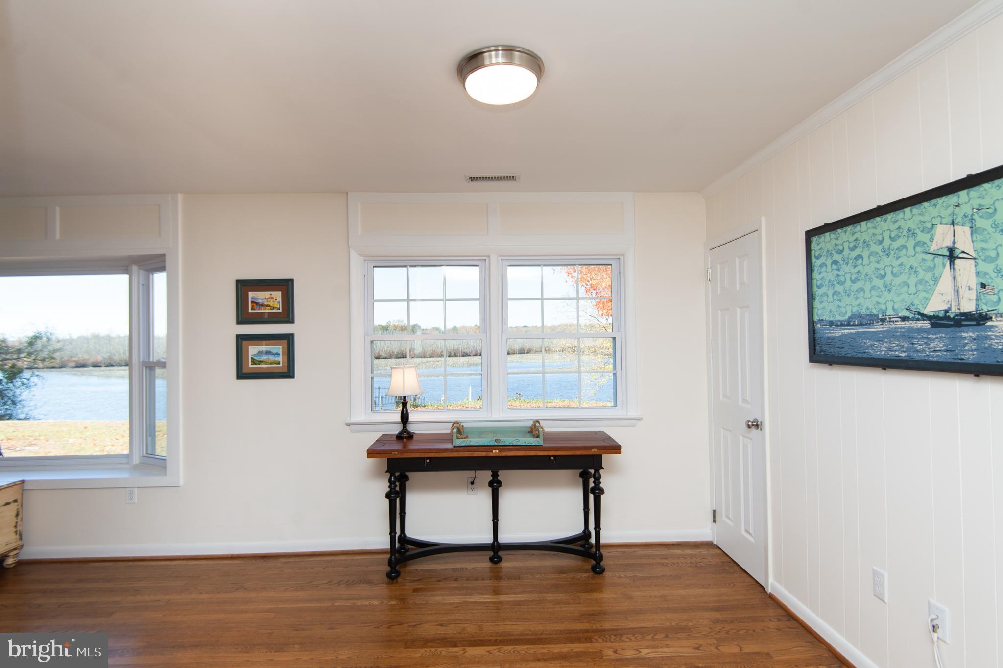 25211 Adams Landing Road Denton, MD 21629 - Photo 37 of 58 a workspace with furniture window and wooden floor