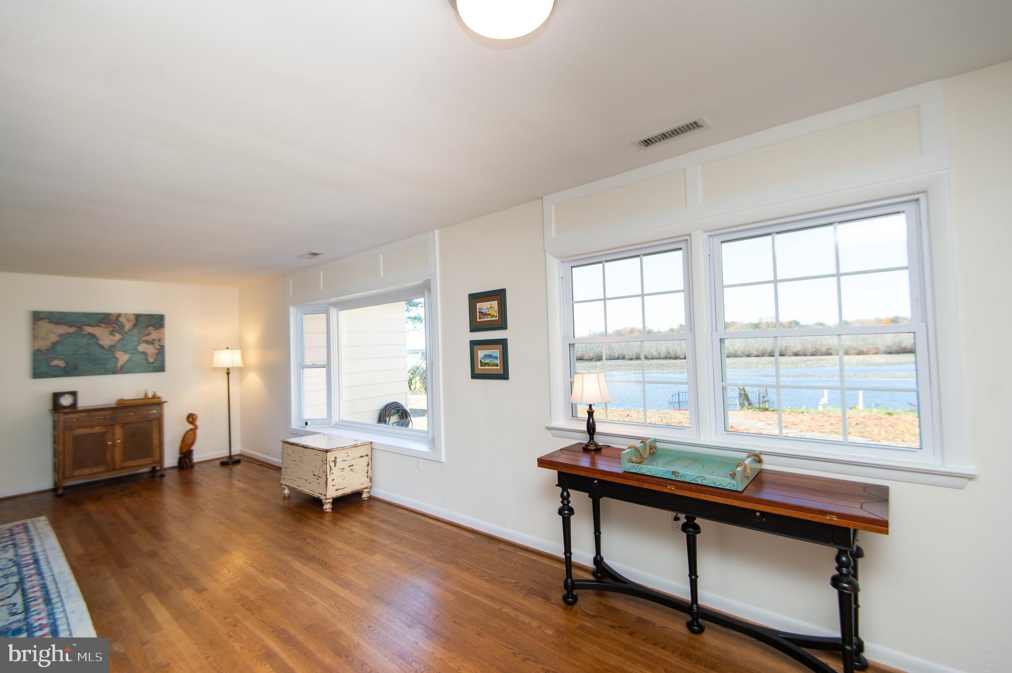 25211 Adams Landing Road Denton, MD 21629 - Photo 38 of 58 a living room with furniture and a window