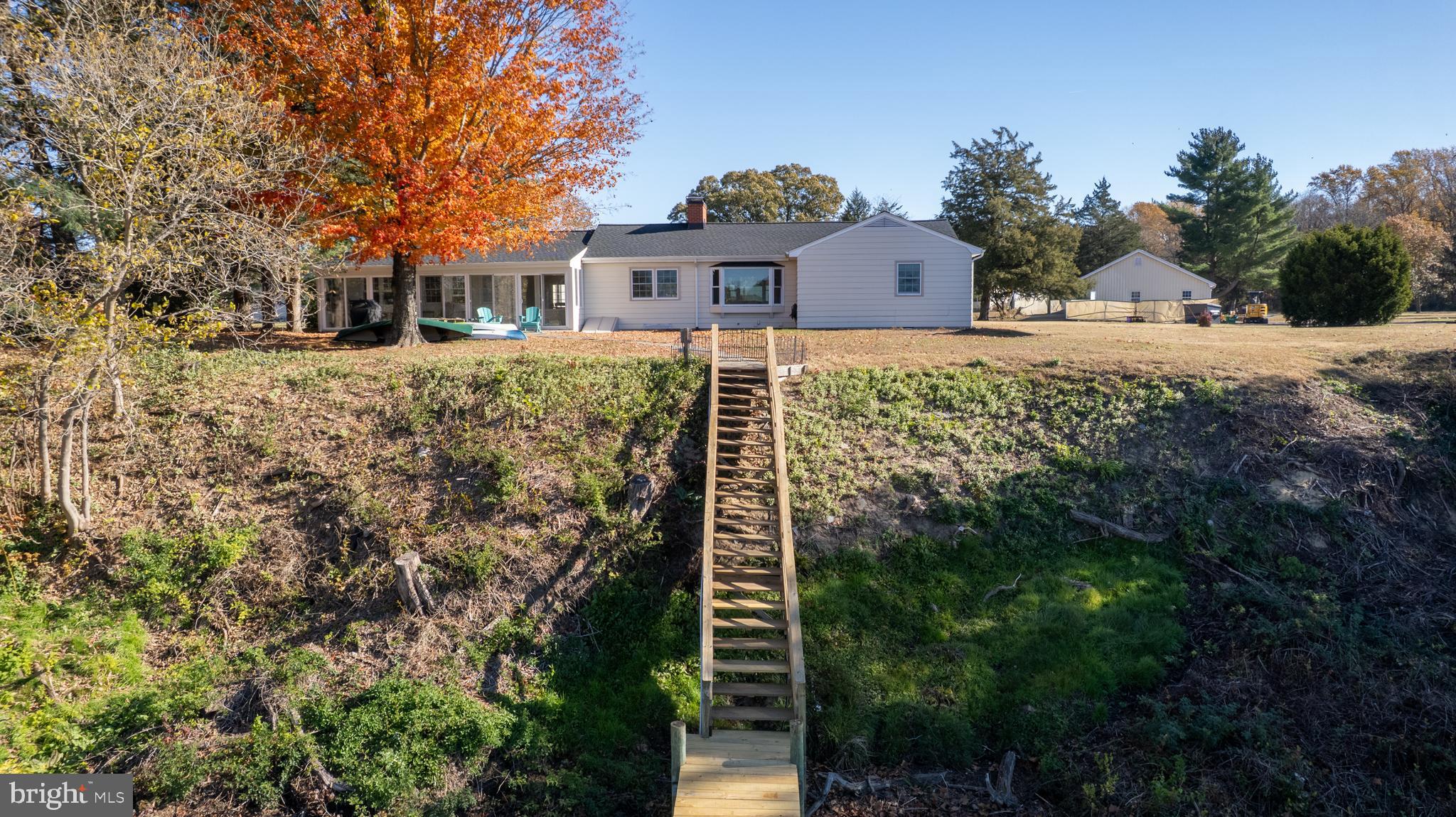 25211 Adams Landing Road Denton, MD 21629 - Photo 4 of 58 a front view of a house with a yard