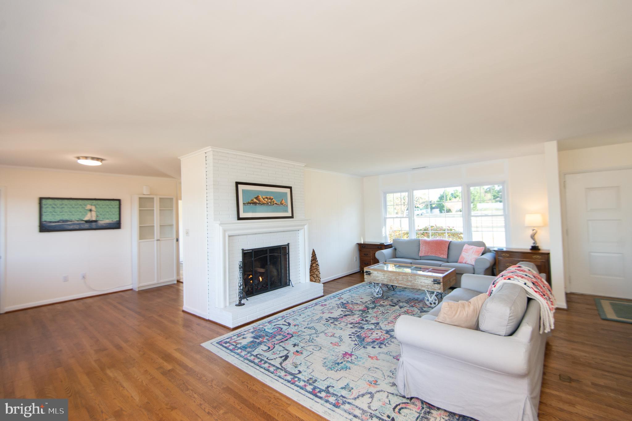 25211 Adams Landing Road Denton, MD 21629 - Photo 42 of 58 a living room with furniture and a fireplace