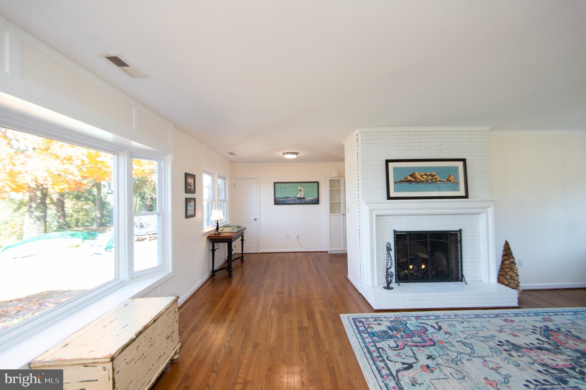 25211 Adams Landing Road Denton, MD 21629 - Photo 43 of 58 a living room with furniture and a fireplace