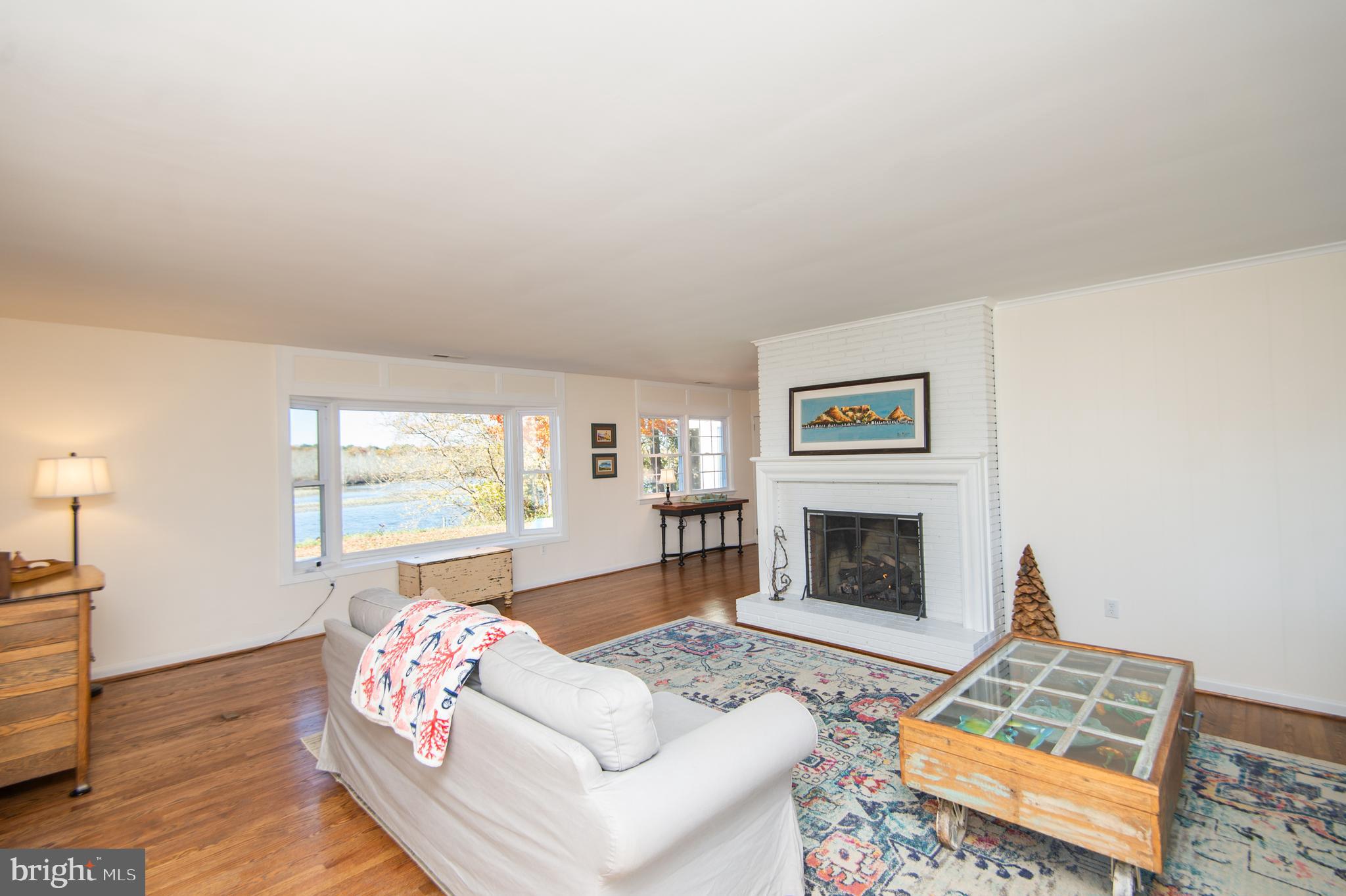 25211 Adams Landing Road Denton, MD 21629 - Photo 44 of 58 a living room with furniture fireplace and window