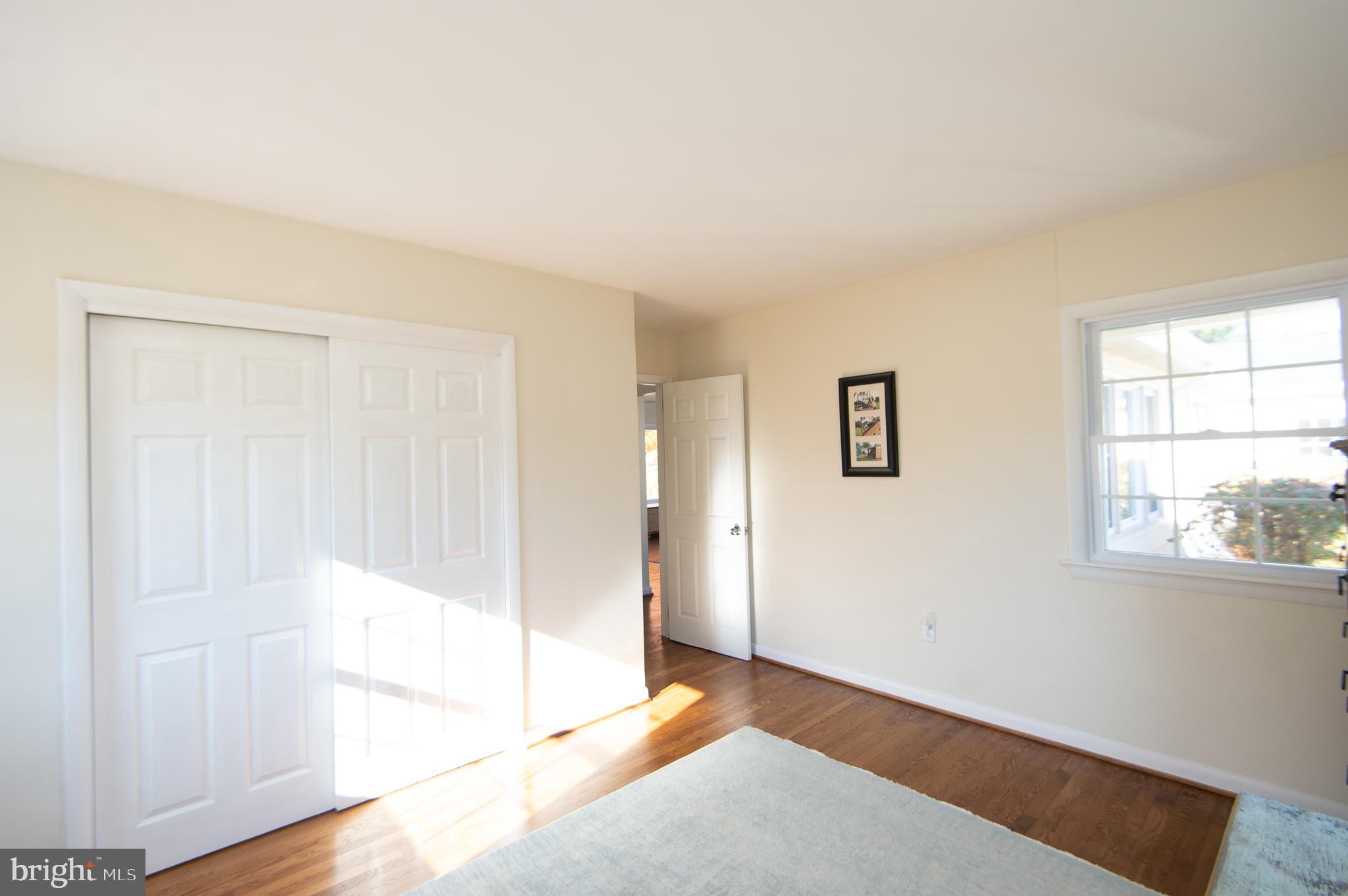 25211 Adams Landing Road Denton, MD 21629 - Photo 50 of 58 a view of an empty room with wooden floor and a window