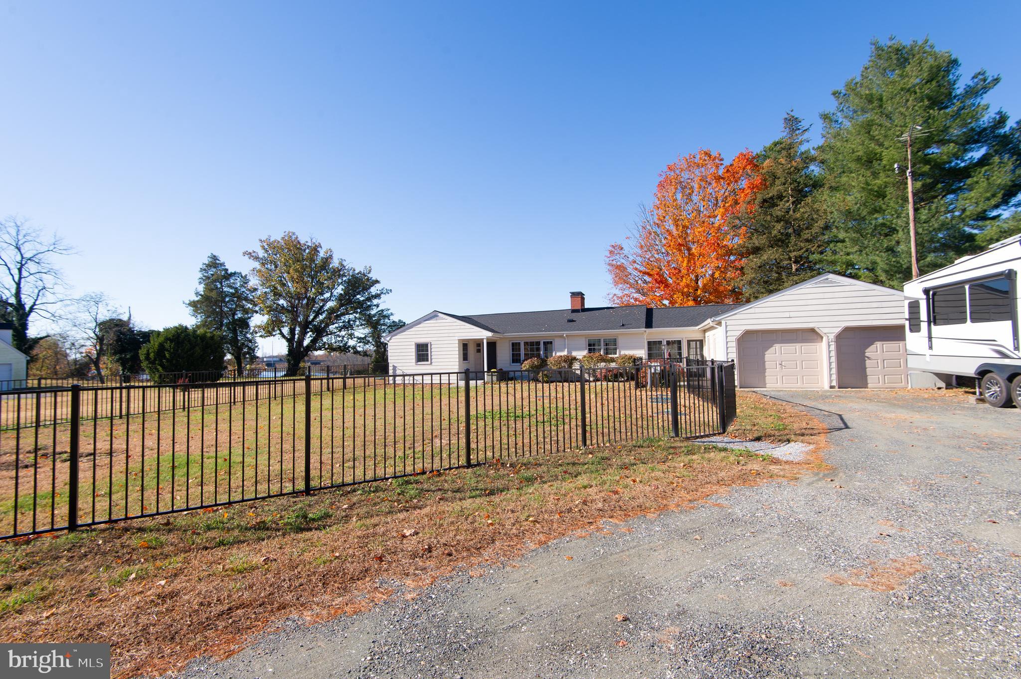 25211 Adams Landing Road Denton, MD 21629 - Photo 5 of 58 a front view of a house with a yard