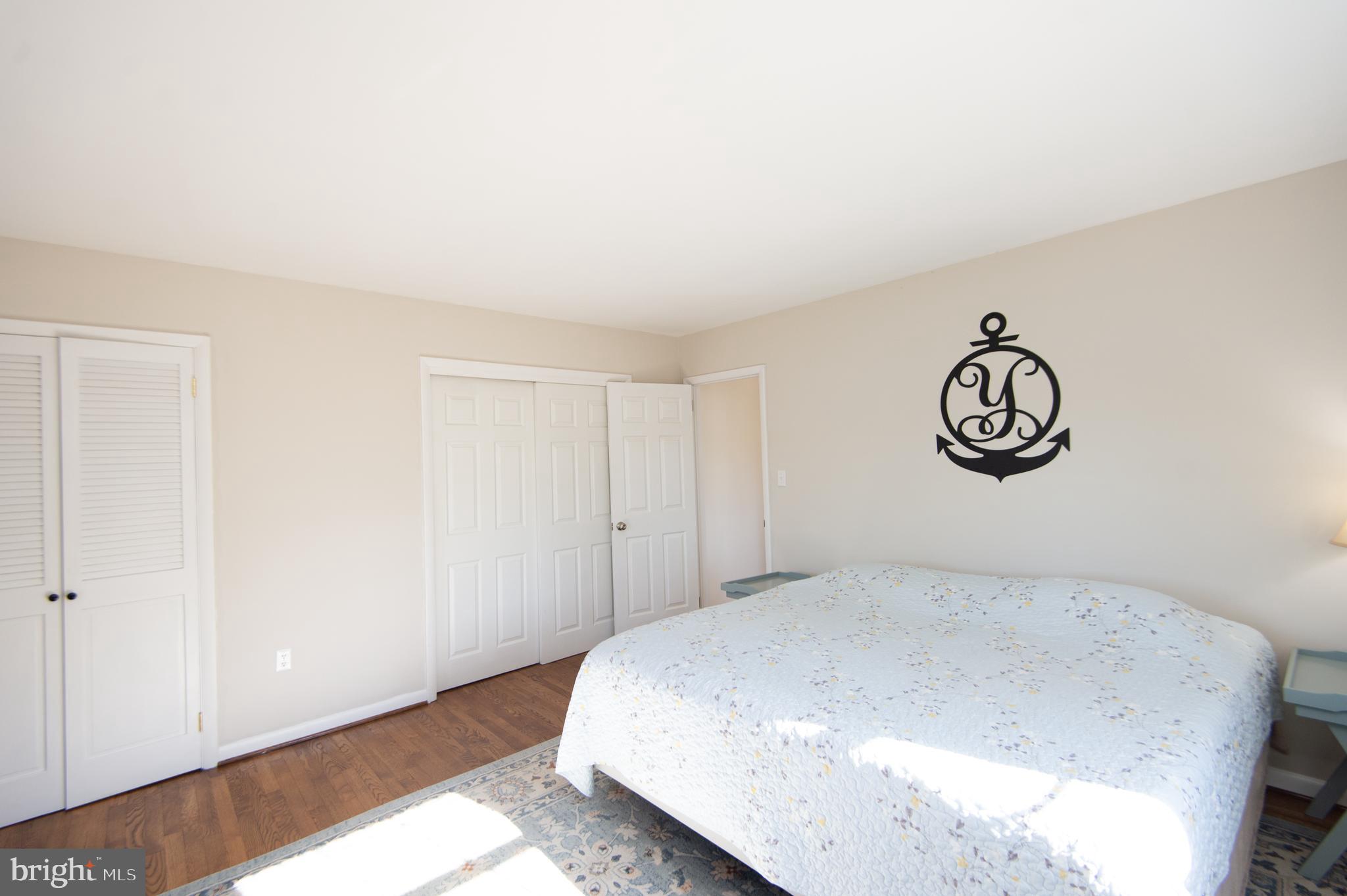 25211 Adams Landing Road Denton, MD 21629 - Photo 56 of 58 a bedroom with a bed and a table