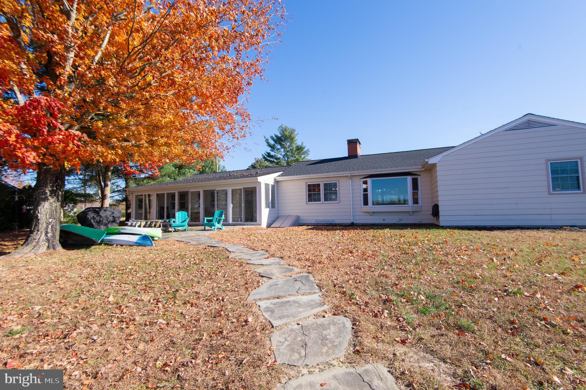 25211 Adams Landing Road Denton, MD 21629 - Photo 9 of 58 a front view of a house with yard porch and seating space