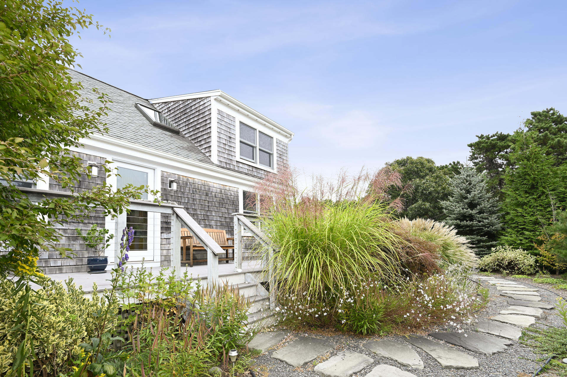 15 Clayton Road Eastham, MA 02642 - Photo 1 of 49 a view of a house with a small yard and plants