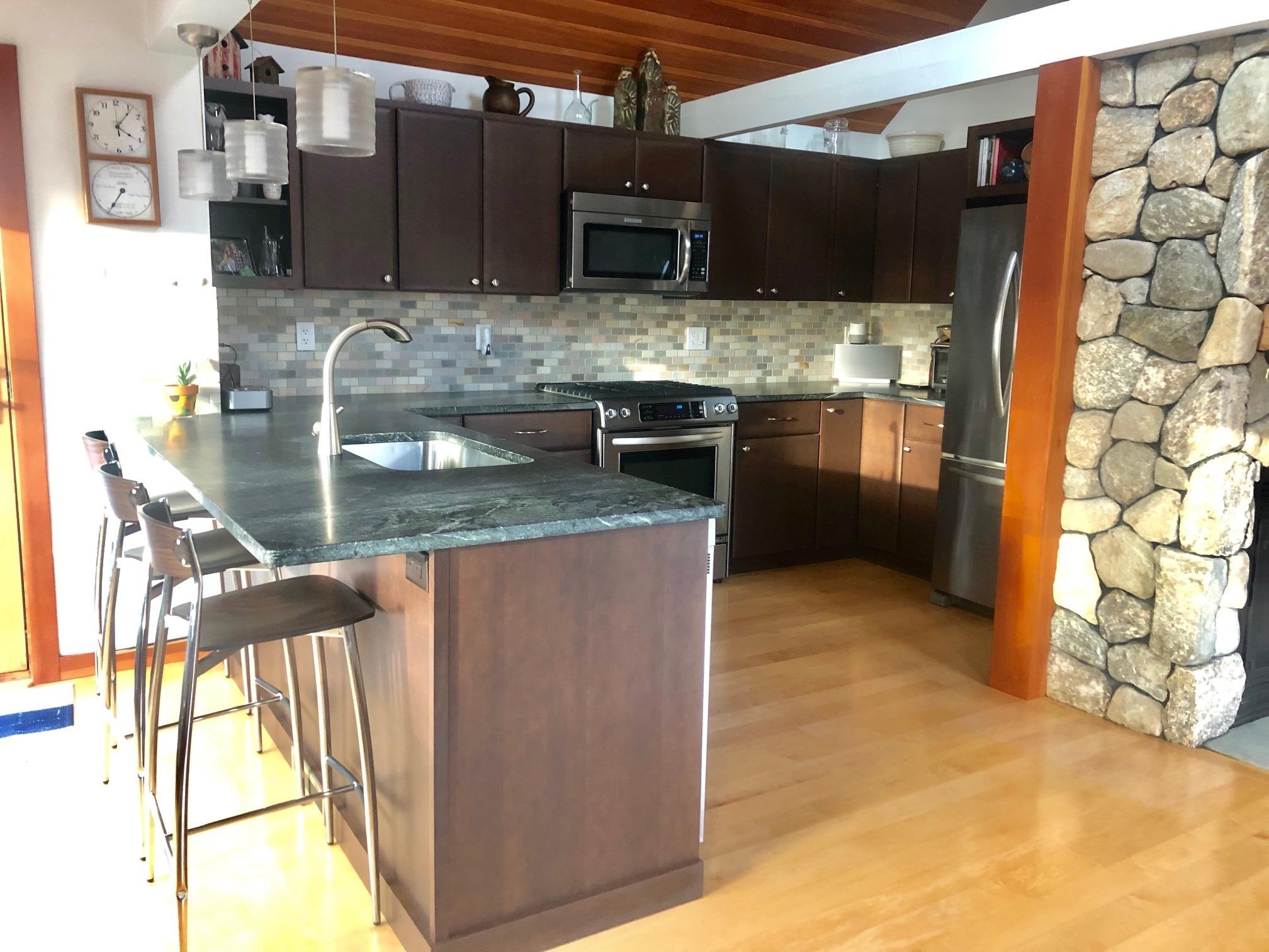 15 Clayton Road Eastham, MA 02642 - Photo 12 of 49 a kitchen with stainless steel appliances granite countertop a sink and a stove top oven