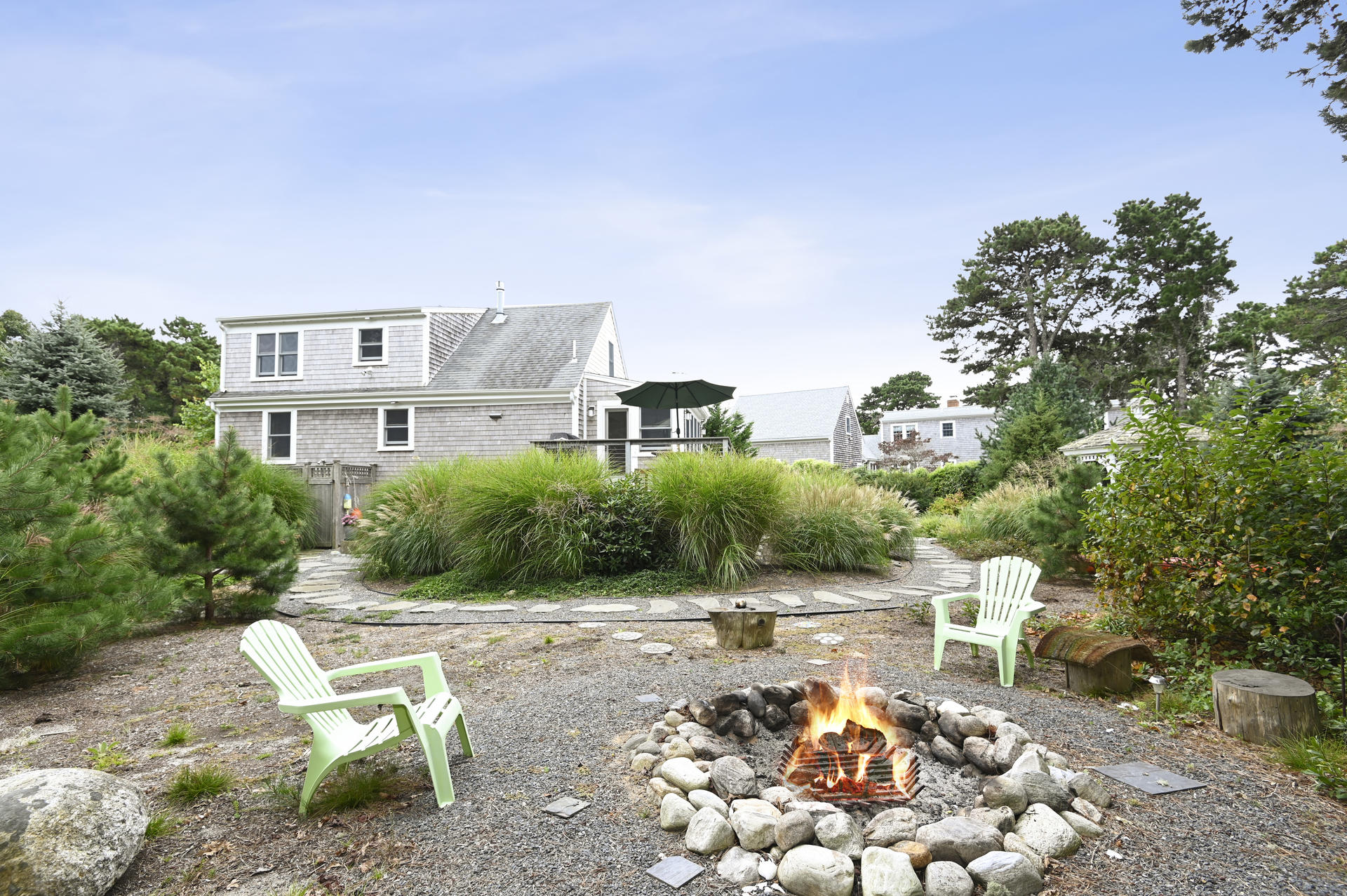 15 Clayton Road Eastham, MA 02642 - Photo 23 of 49 a view of a chairs and table in backyard