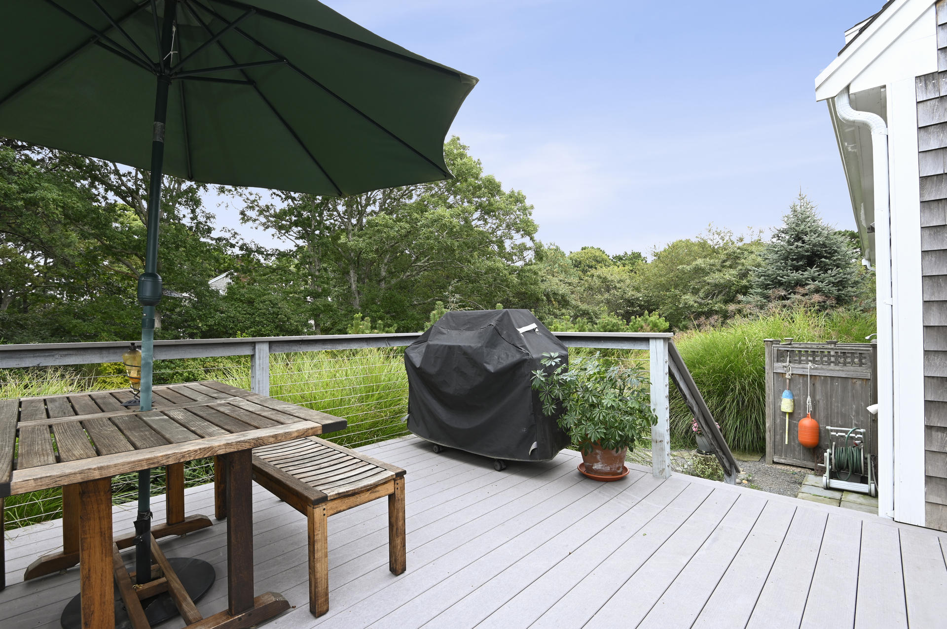 15 Clayton Road Eastham, MA 02642 - Photo 25 of 49 a view of a deck with wooden floor and barbeque oven