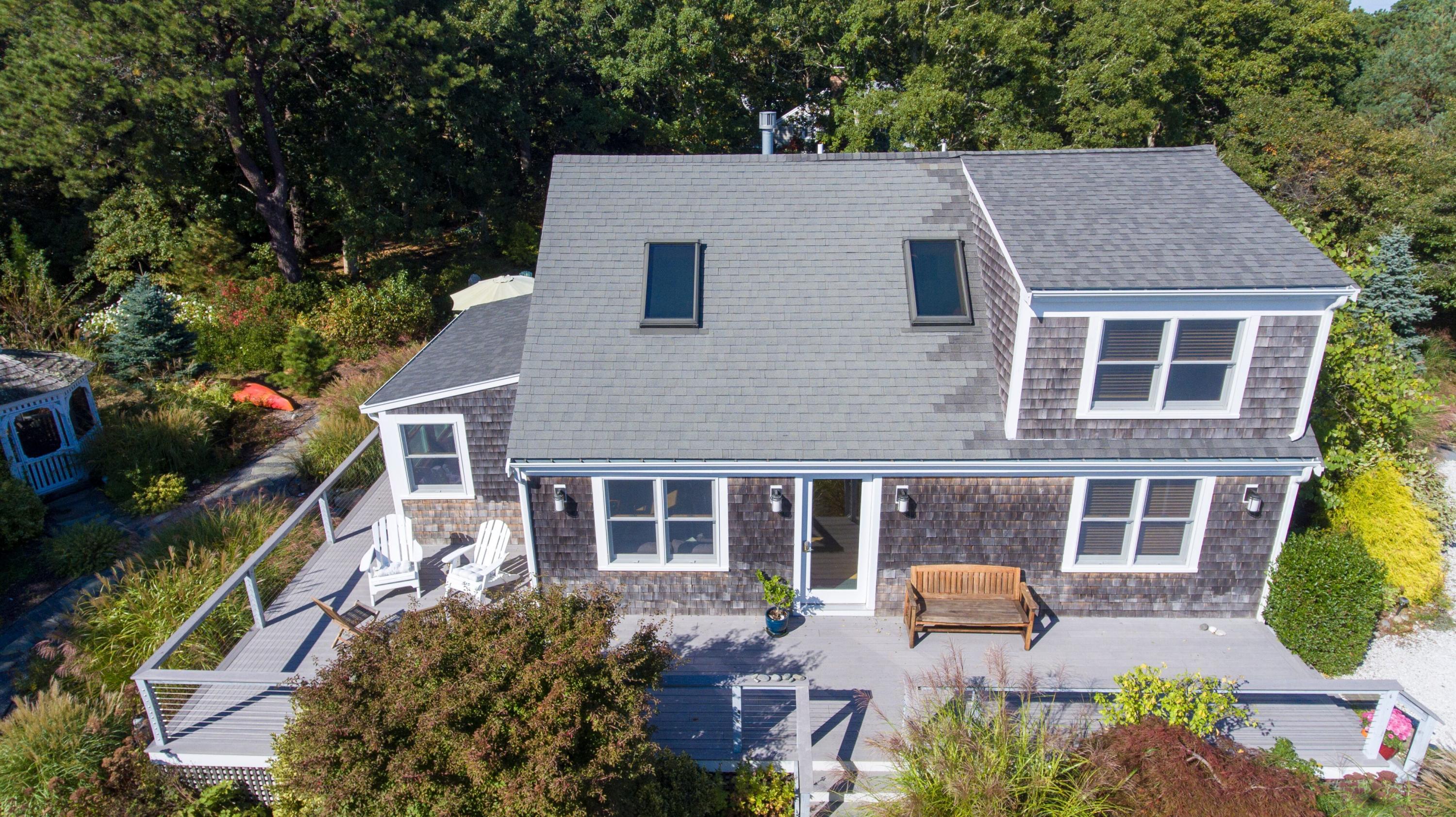 15 Clayton Road Eastham, MA 02642 - Photo 5 of 49 a aerial view of a house with a yard and sitting space