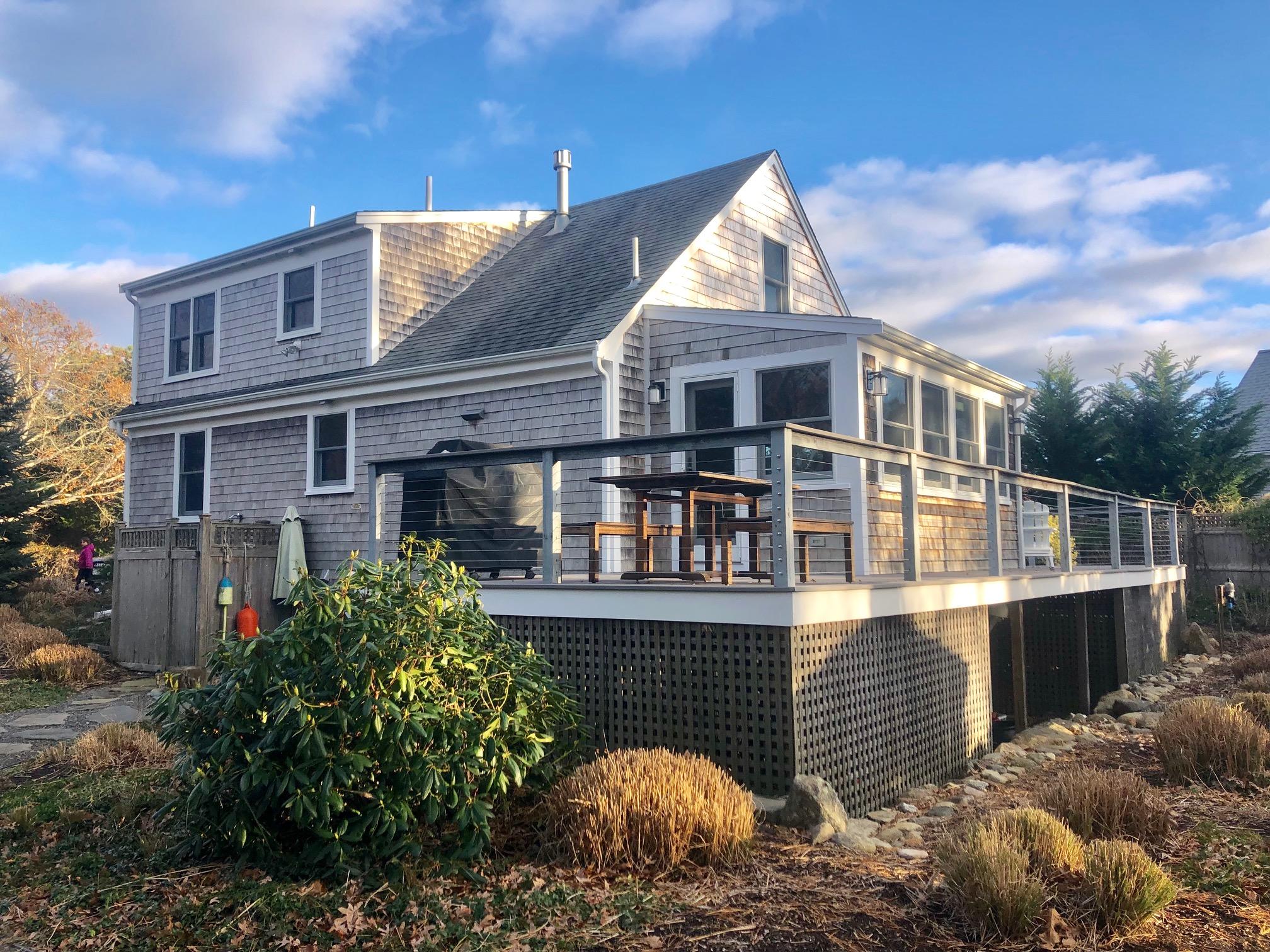 15 Clayton Road Eastham, MA 02642 - Photo 8 of 49 a front view of a house with a garden