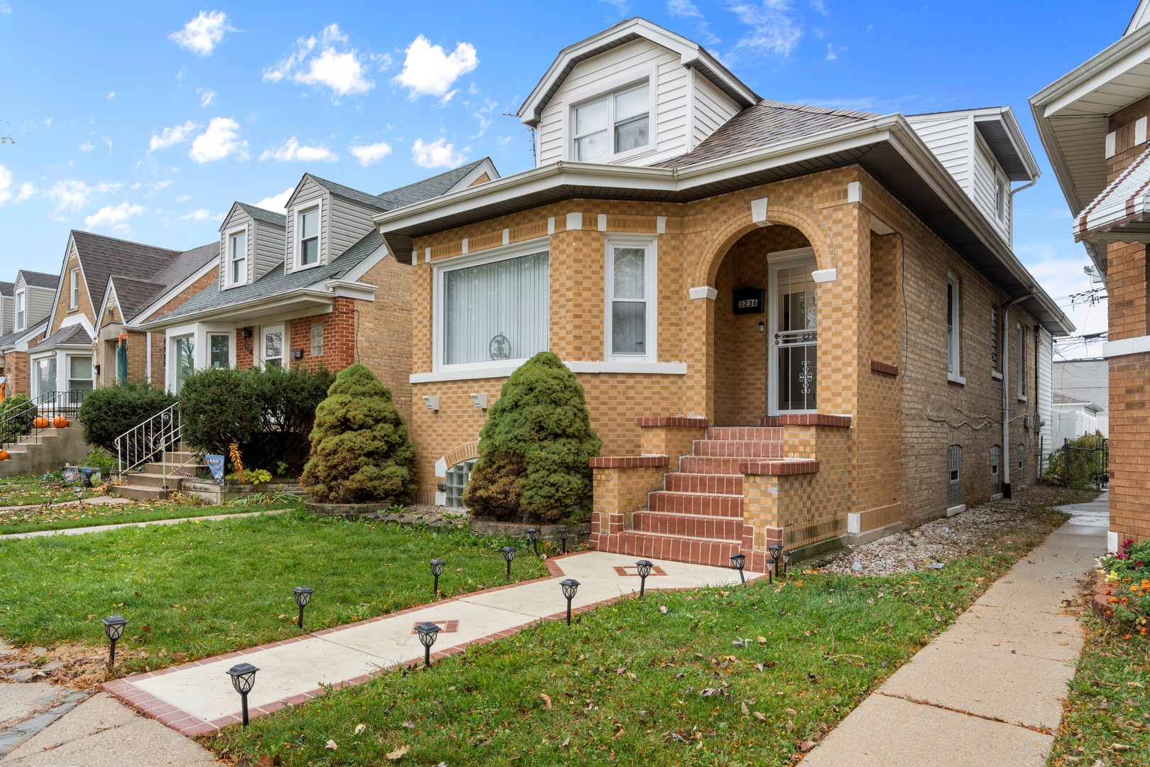 3236 North Neva Avenue Chicago, IL 60634 - Photo 1 of 19 a front view of a house with a yard