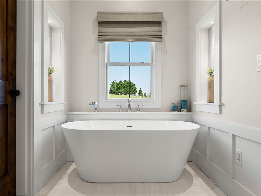 331 Bakerville Road Easley, SC 29642 - Photo 21 of 43 This serene bathroom offers a spacious soaking tub, perfect for unwinding in comfort and style.