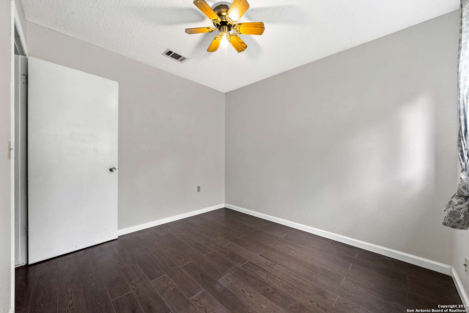 109 Meadow Way Converse, TX 78109 - Photo 20 of 25 a view of a room with wooden floor