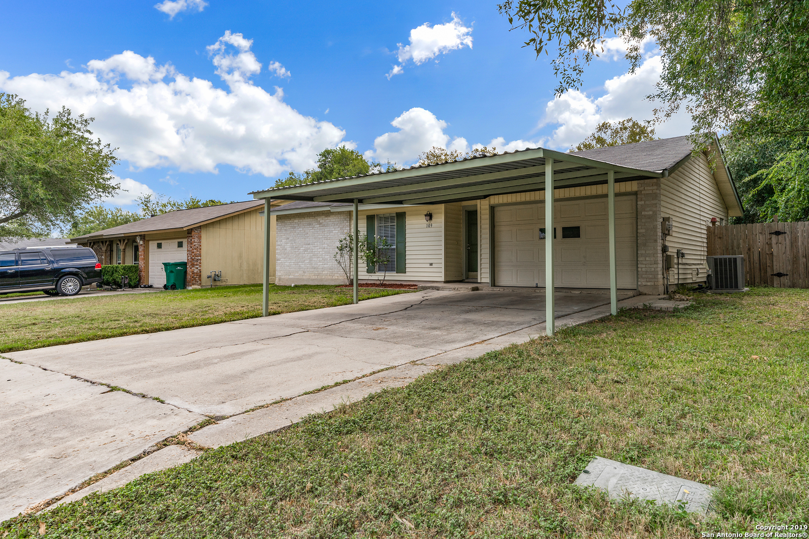 109 Meadow Way Converse, TX 78109 - Photo 2 of 25 a view of a white house with a yard and potted plants