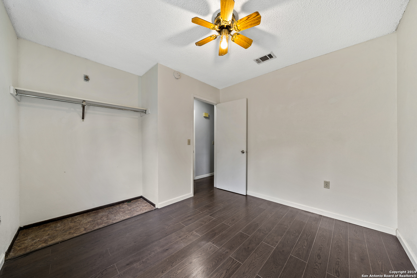 109 Meadow Way Converse, TX 78109 - Photo 21 of 25 a view of an empty room with wooden floor