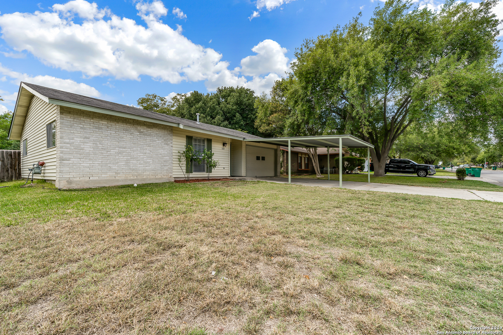 109 Meadow Way Converse, TX 78109 - Photo 3 of 25 a house with trees in the background
