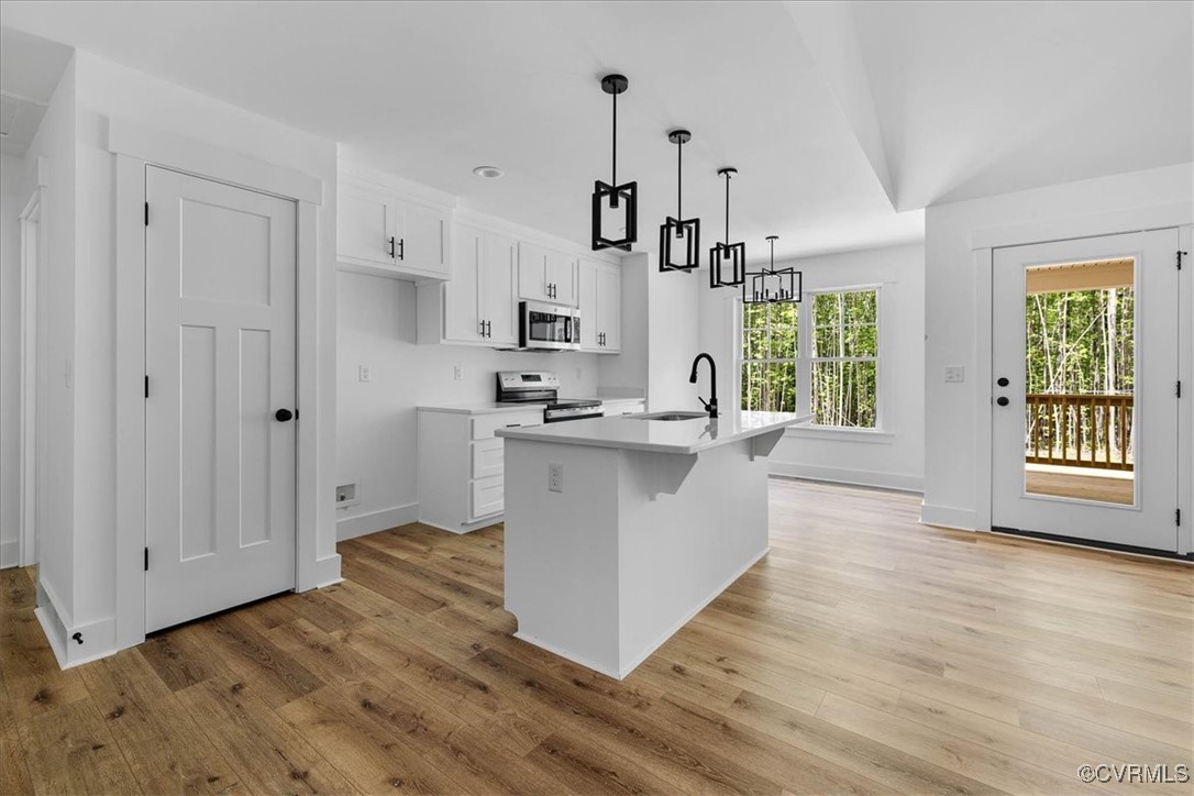 14954 Lebanon Road Spring Grove, VA 23881 - Photo 11 of 29 Kitchen with light wood finished floors, an island