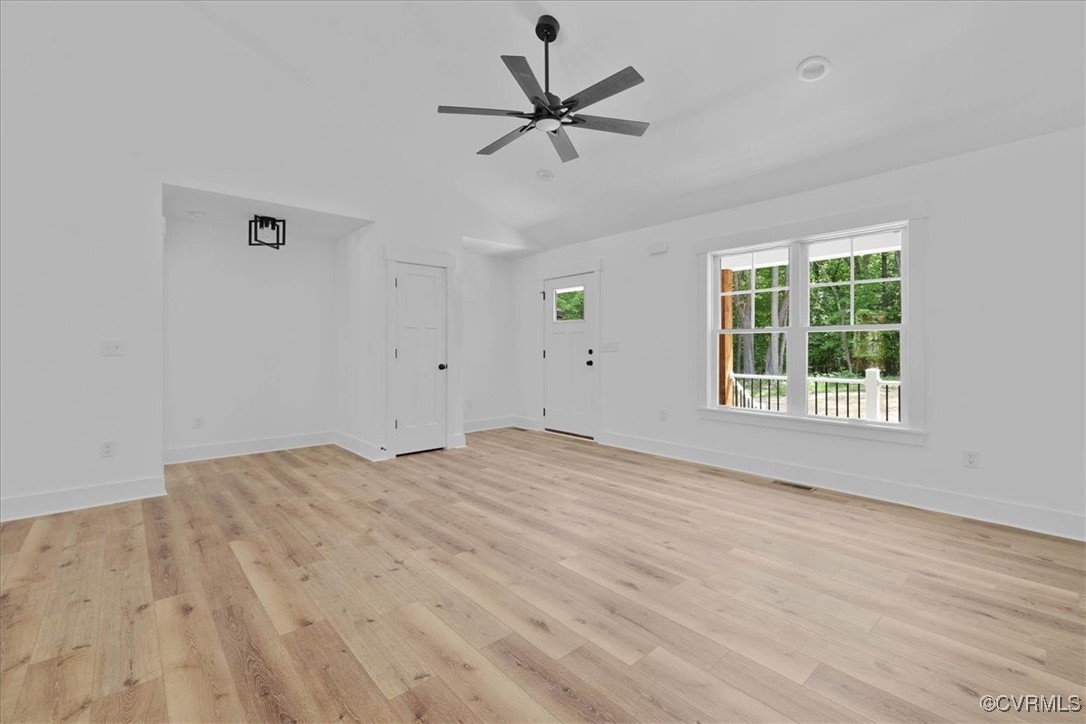 14954 Lebanon Road Spring Grove, VA 23881 - Photo 7 of 29 Unfurnished living room with lofted ceiling, baseb