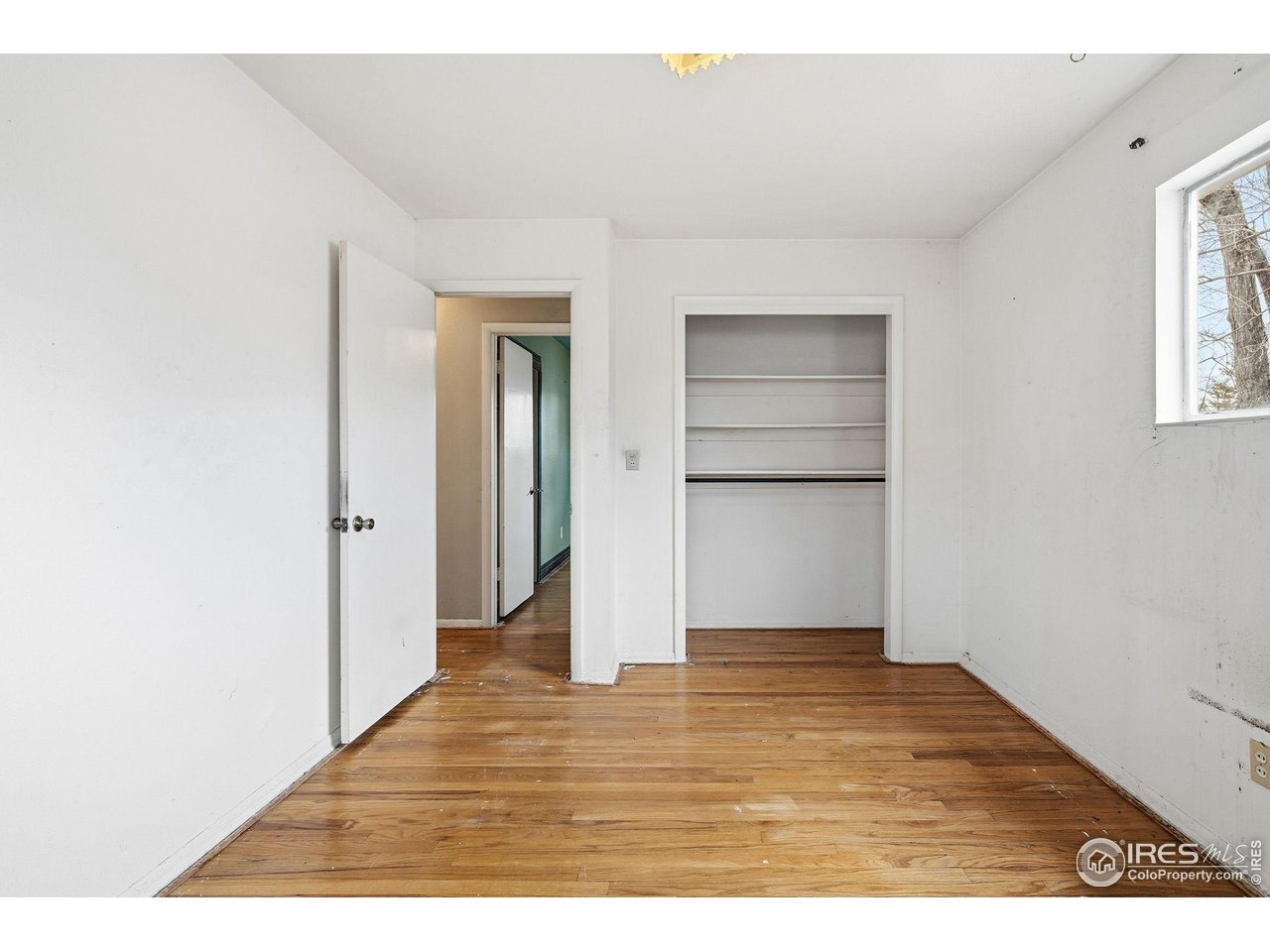 4595 Moorhead Avenue Boulder, CO 80305 - Photo 17 of 40 a view of an empty room with closet and window