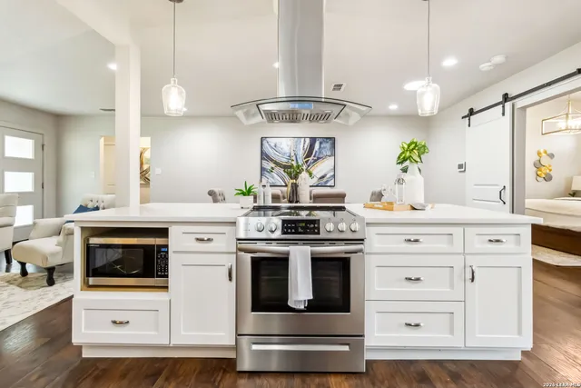 a kitchen with a stove and a sink