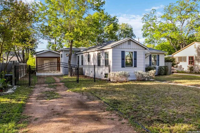 a front view of a house with a yard and porch