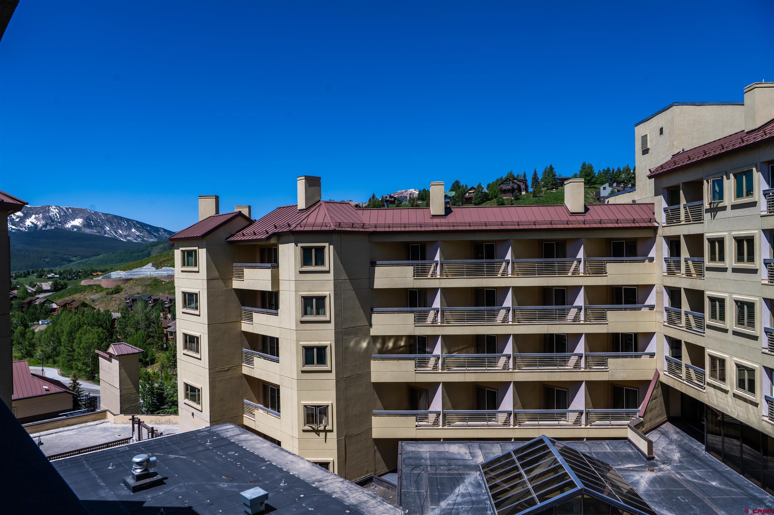 500 Gothic Road, Unit 539 Crested Butte, CO 81225 - Photo 17 of 20 a front view of a building with a porch