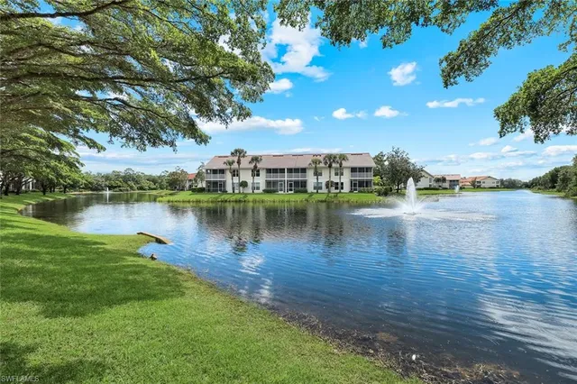 a front view of a house with a yard and a garage