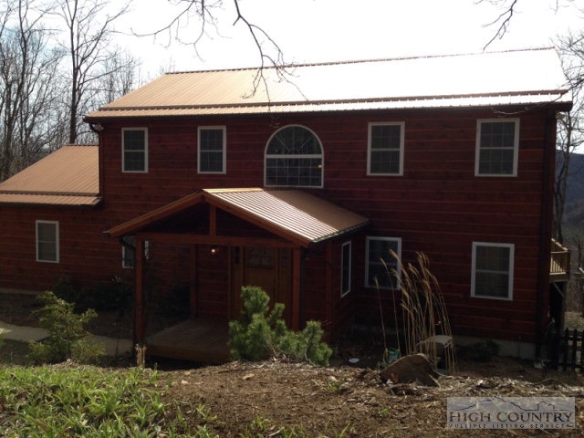 620 Green Knob Mountain Road Boone, NC 28607 - Photo 1 of 43 a front view of a house with garden
