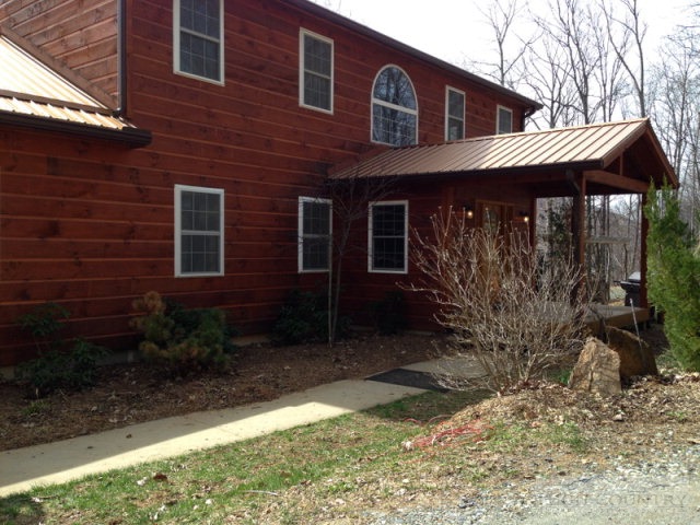 620 Green Knob Mountain Road Boone, NC 28607 - Photo 2 of 43 a front view of a house with garden