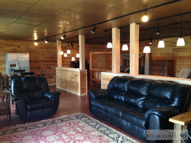 620 Green Knob Mountain Road Boone, NC 28607 - Photo 21 of 43 a living room with a couch and a coffee table