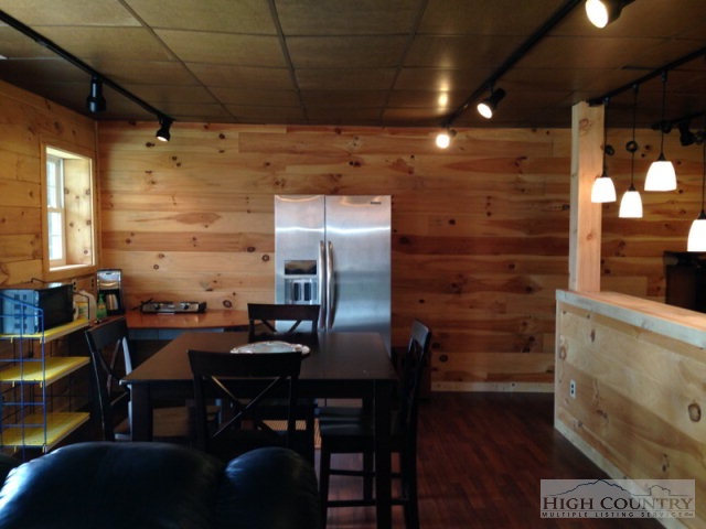 620 Green Knob Mountain Road Boone, NC 28607 - Photo 23 of 43 a kitchen with a table and chairs