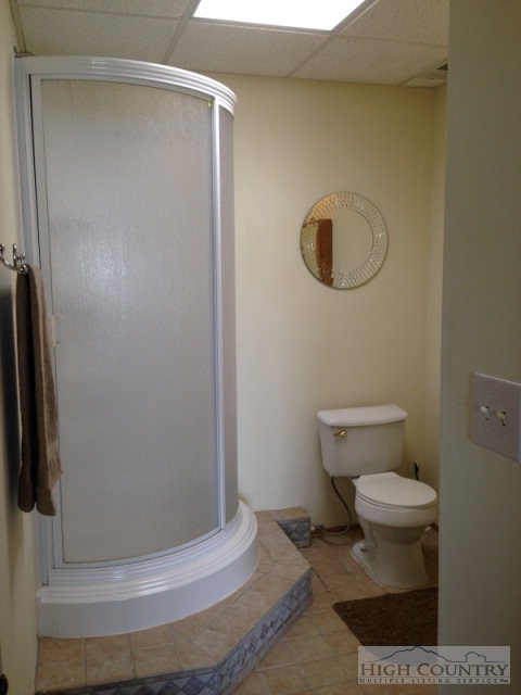 620 Green Knob Mountain Road Boone, NC 28607 - Photo 27 of 43 a bathroom with a toilet and a shower