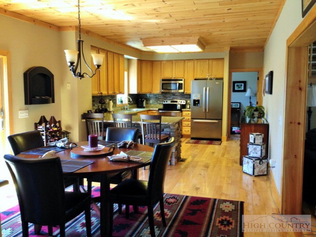 620 Green Knob Mountain Road Boone, NC 28607 - Photo 3 of 43 a view of a dining room with furniture